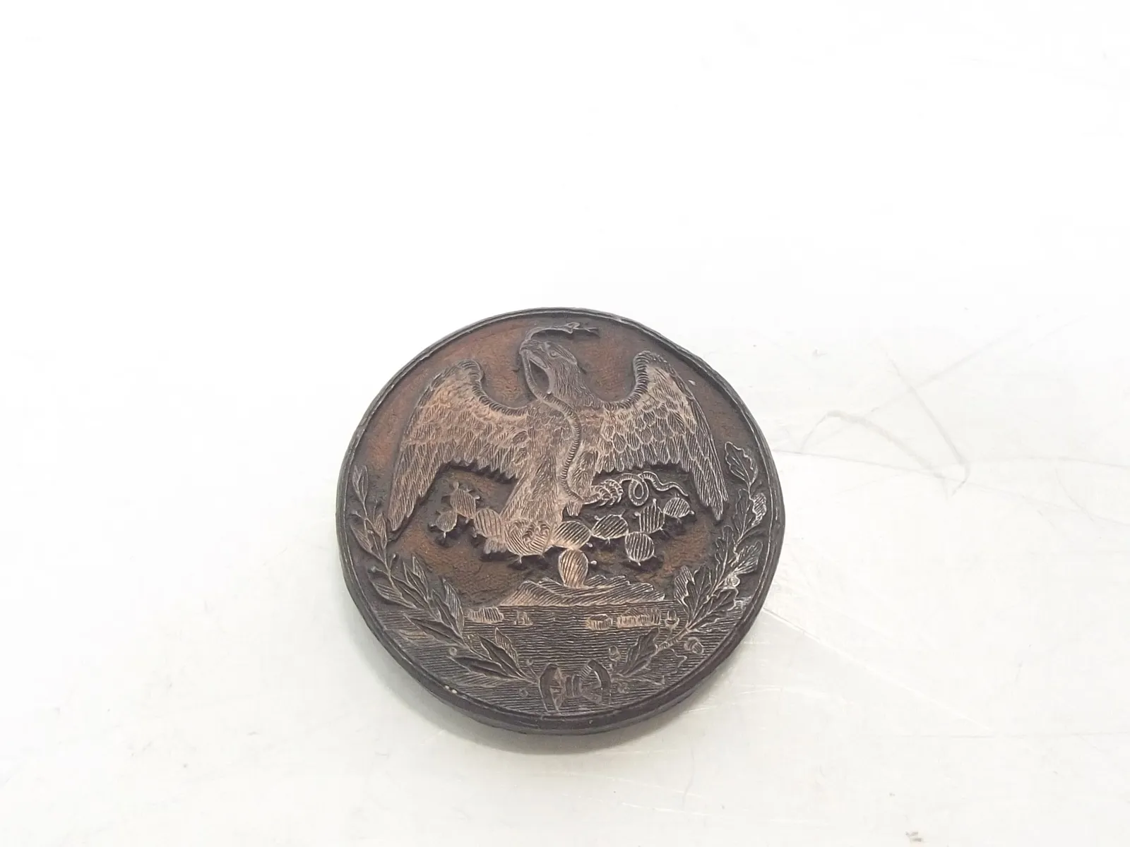 Sello de bronce