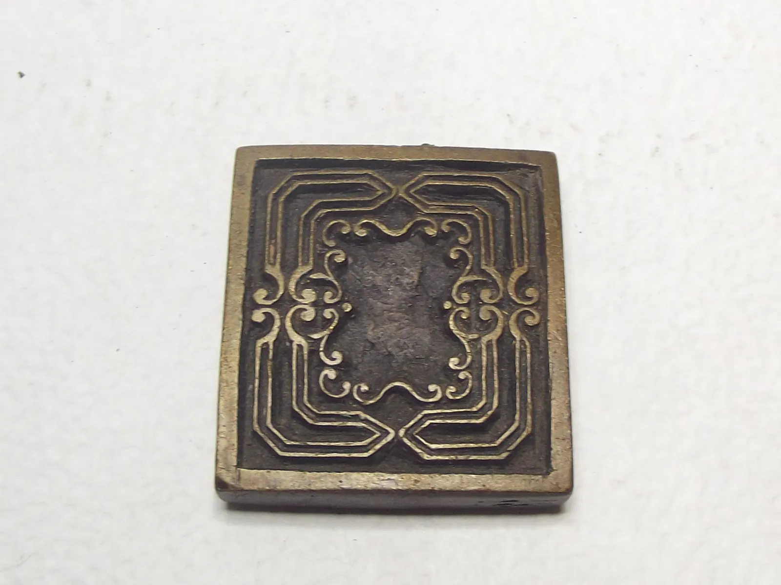 Sello de bronce