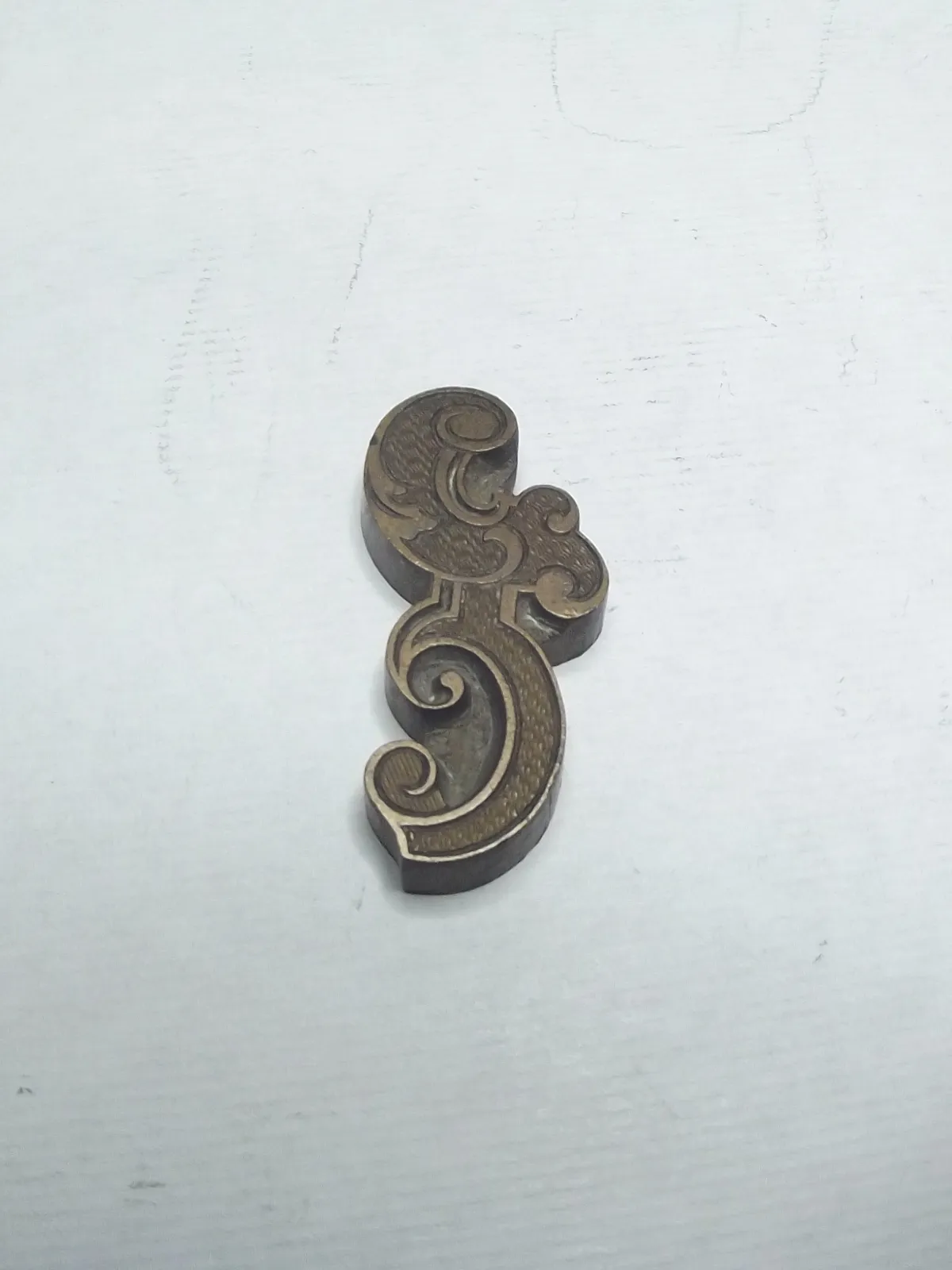 Sello de bronce