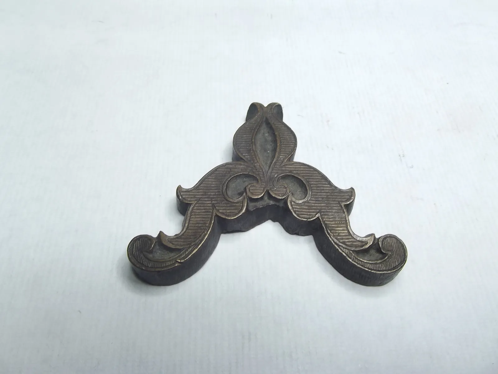 Sello de bronce
