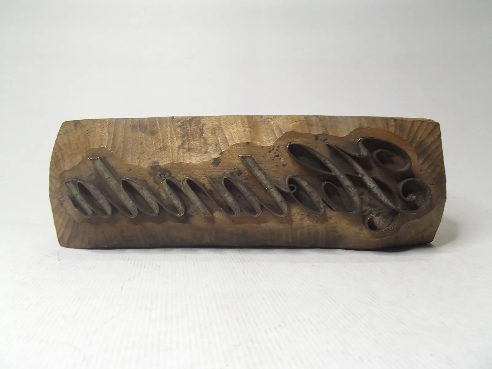 Sello de cobre con base de madera