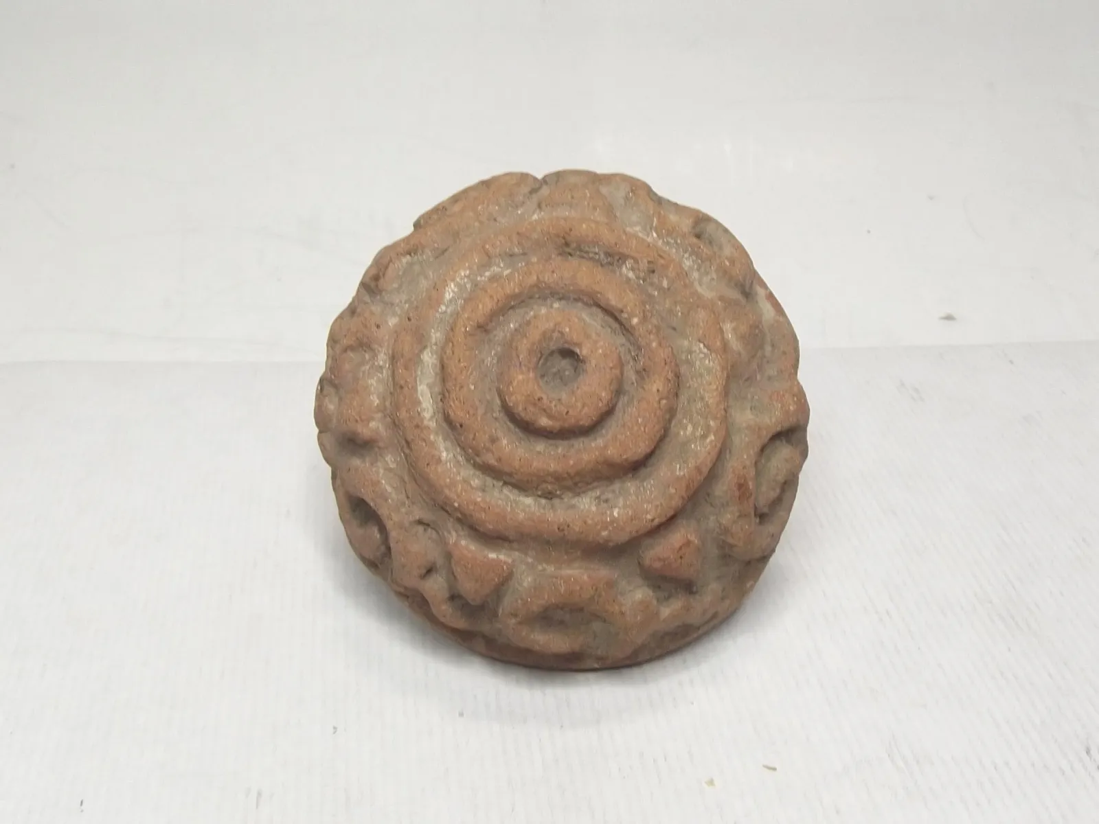 Sello de barro cocido