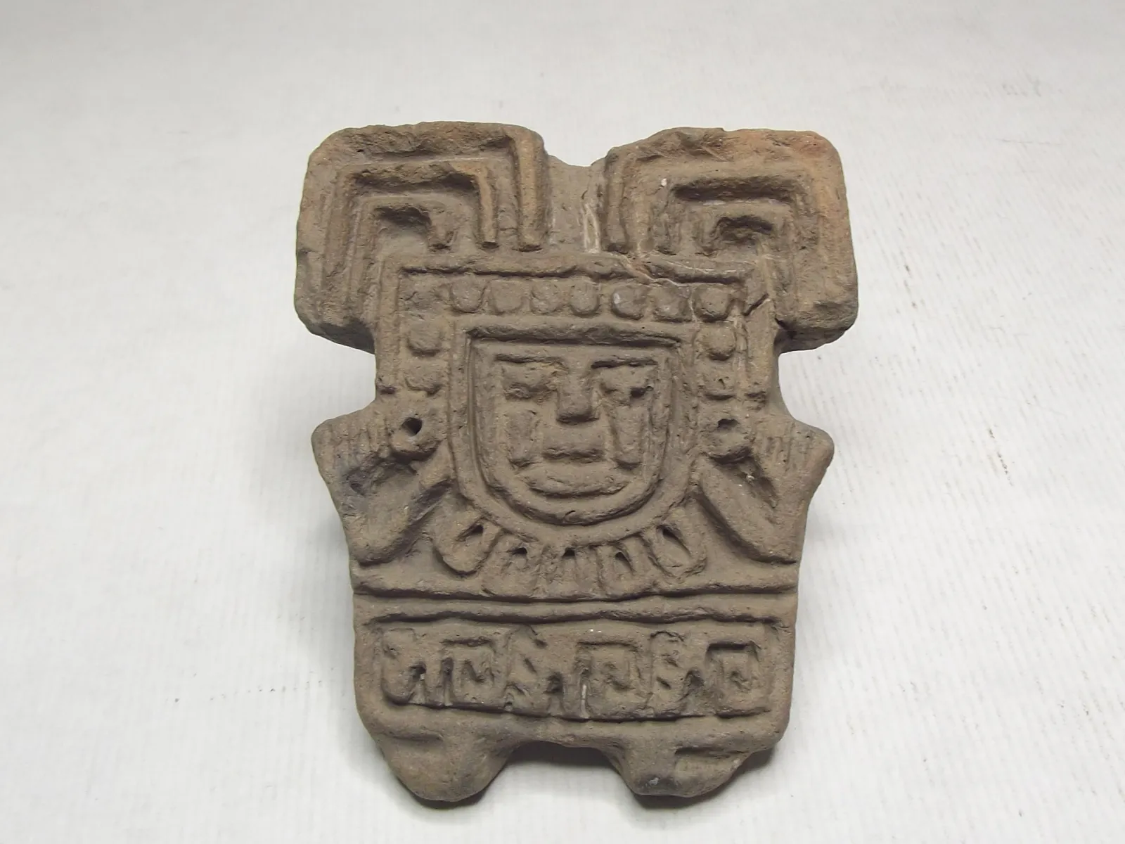 Sello de barro cocido