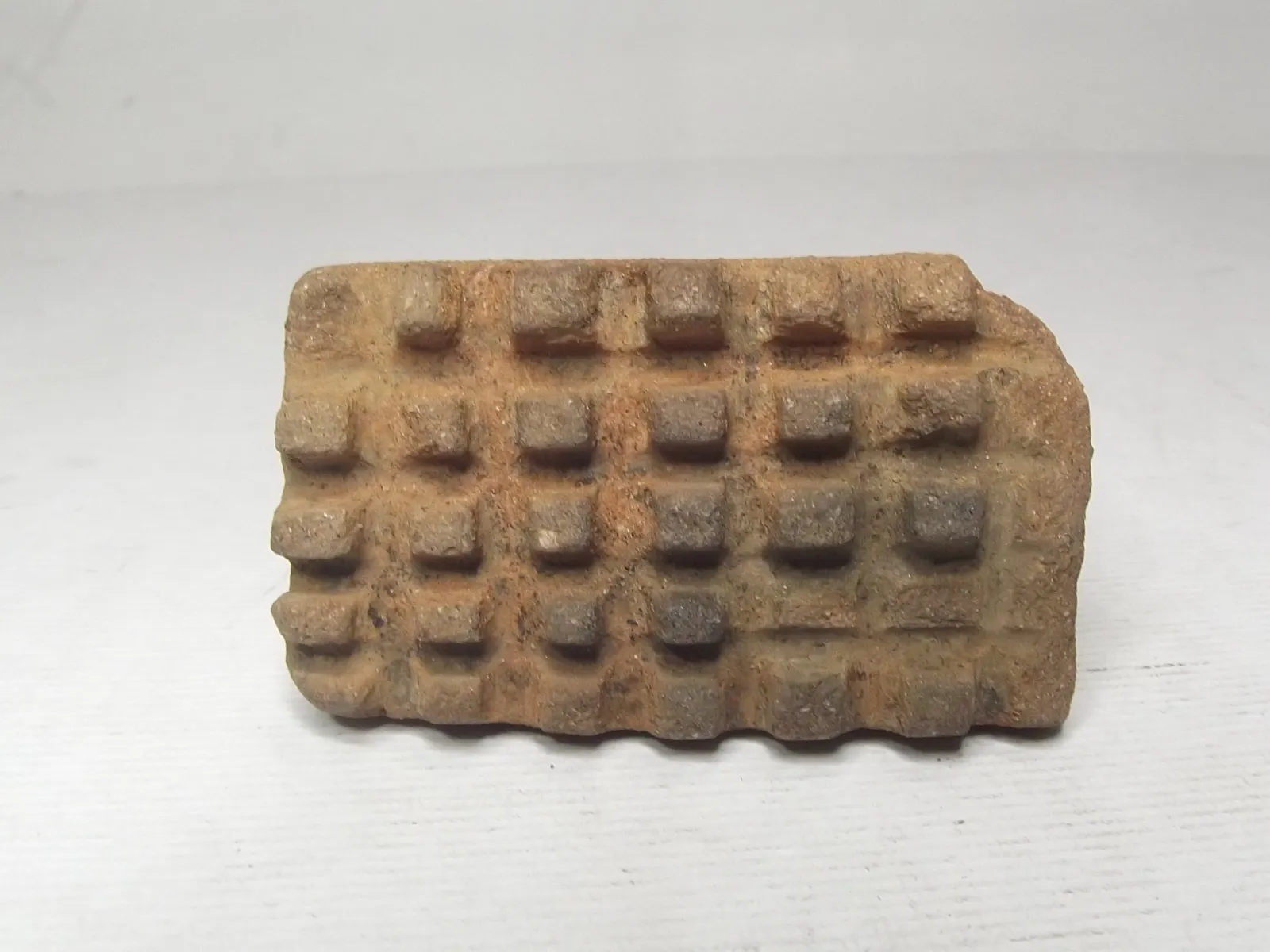 Sello de barro cocido