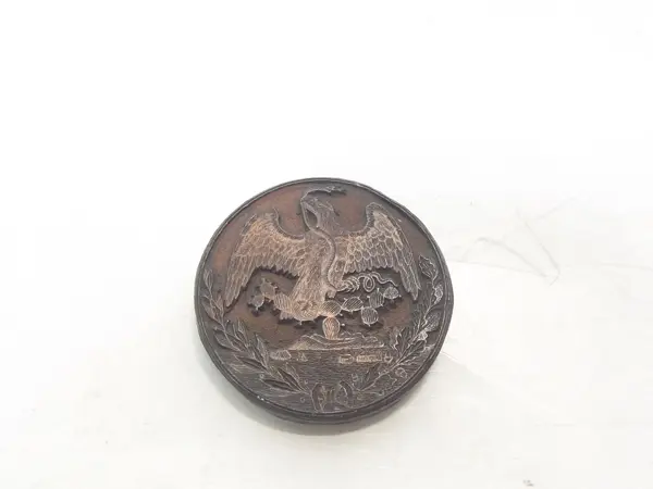 Sello de bronce
