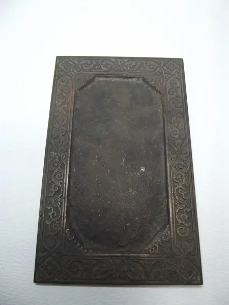 Grabado en bronce