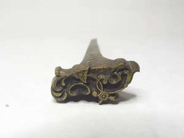 Sello de bronce